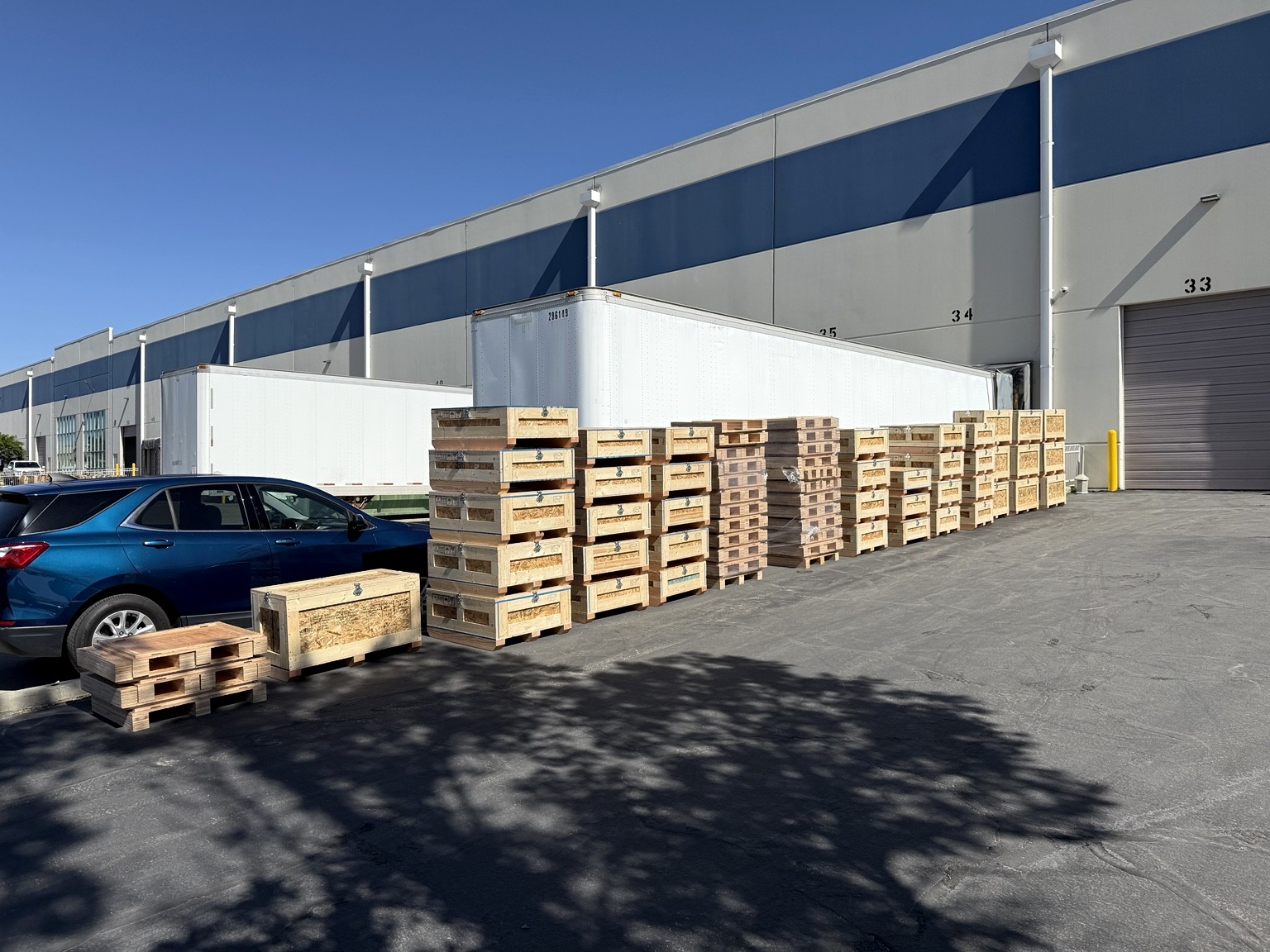 A large production run of Canyon Crates lined up outside a warehouse